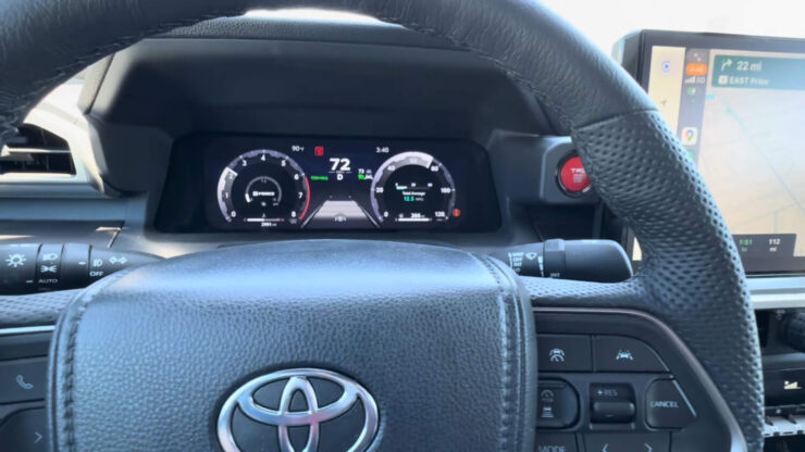 The steering wheel of the Toyota pickup truck while driving